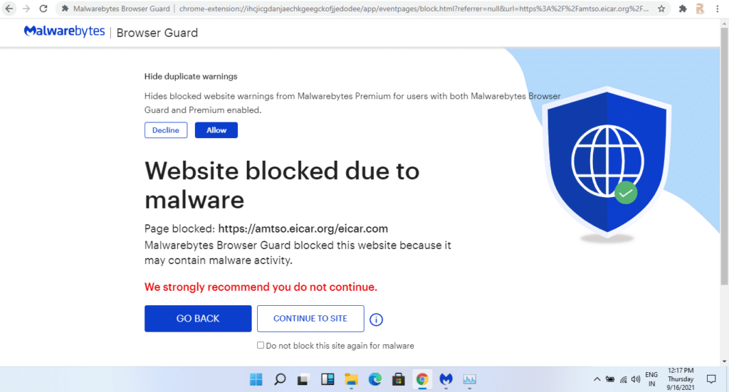 Malwarebytes Premium page displaying “Website blocked due to malware” with button options to “Go back” or “Continue to site.”