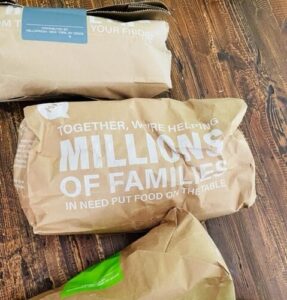 HelloFresh meal kits separated into labeled paper bags